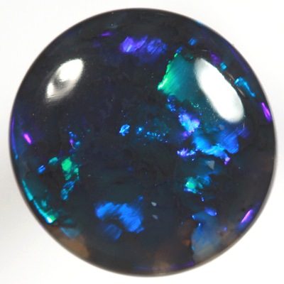 SOLID BLACK OPAL Very bright electric turquoise fire. SEE VIDEO